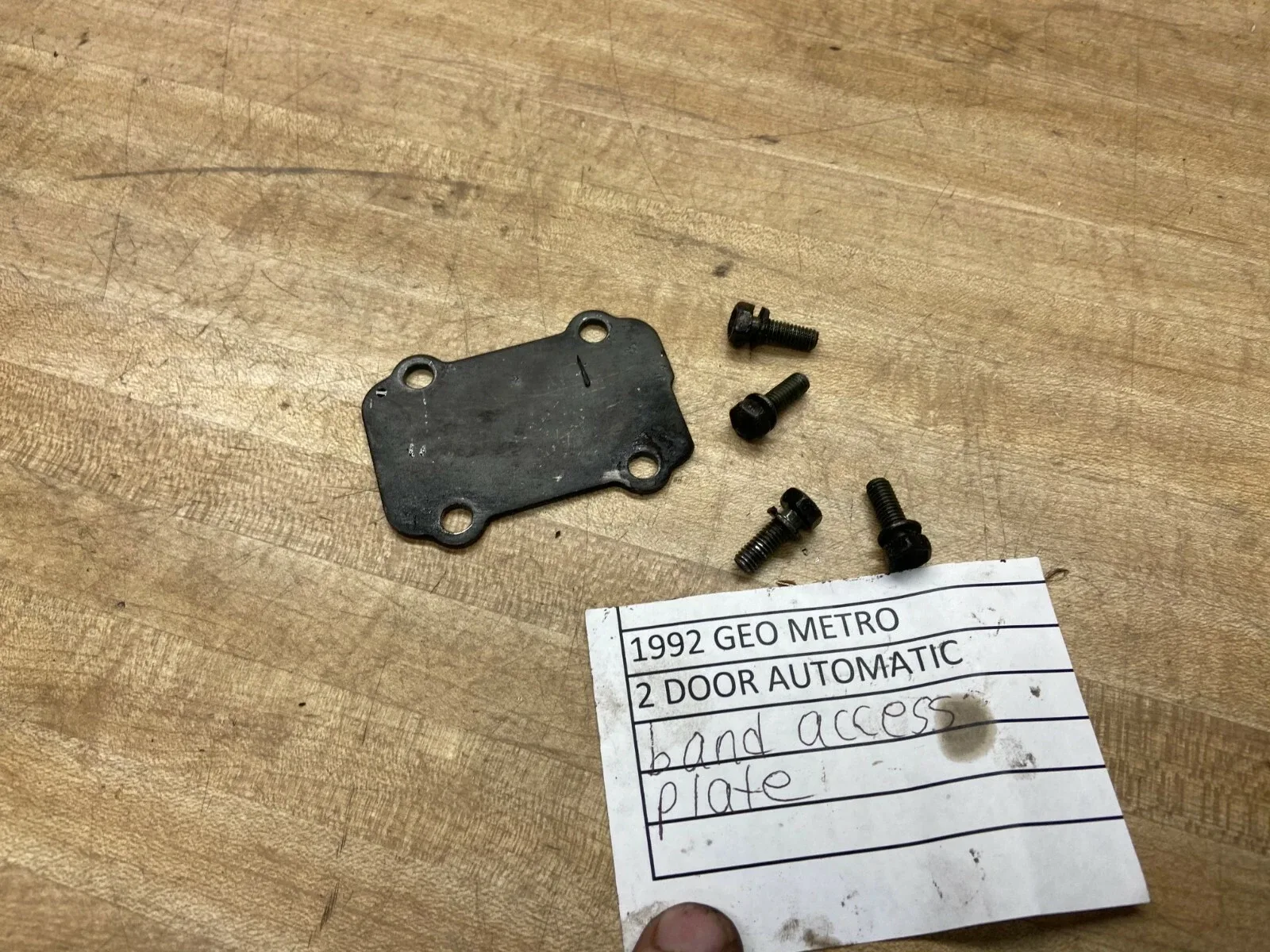 1989-1994 GEO METRO AUTOMATIC TRANSMISSION BAND ACCESS PLATE AND BOLTS image 2