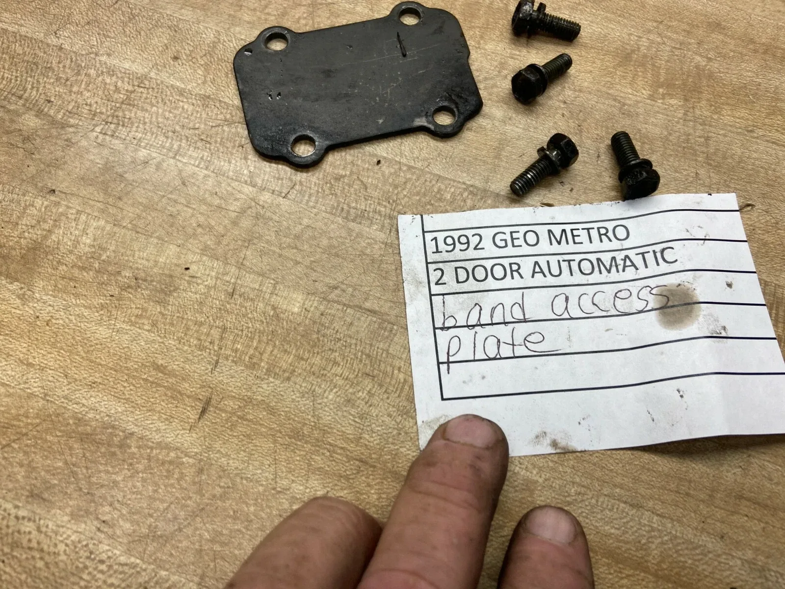 1989-1994 GEO METRO AUTOMATIC TRANSMISSION BAND ACCESS PLATE AND BOLTS image 3
