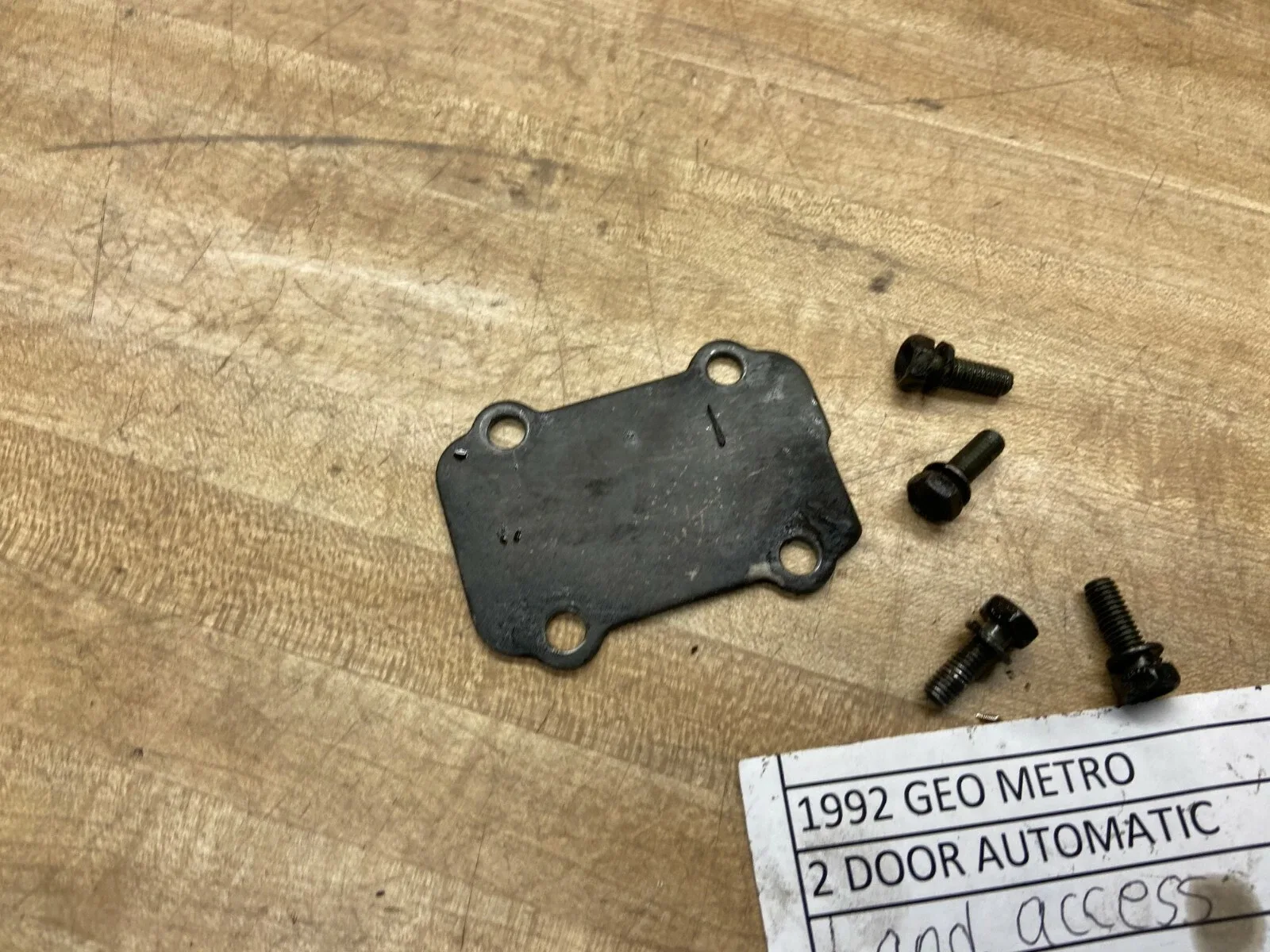 1989-1994 GEO METRO AUTOMATIC TRANSMISSION BAND ACCESS PLATE AND BOLTS image 4