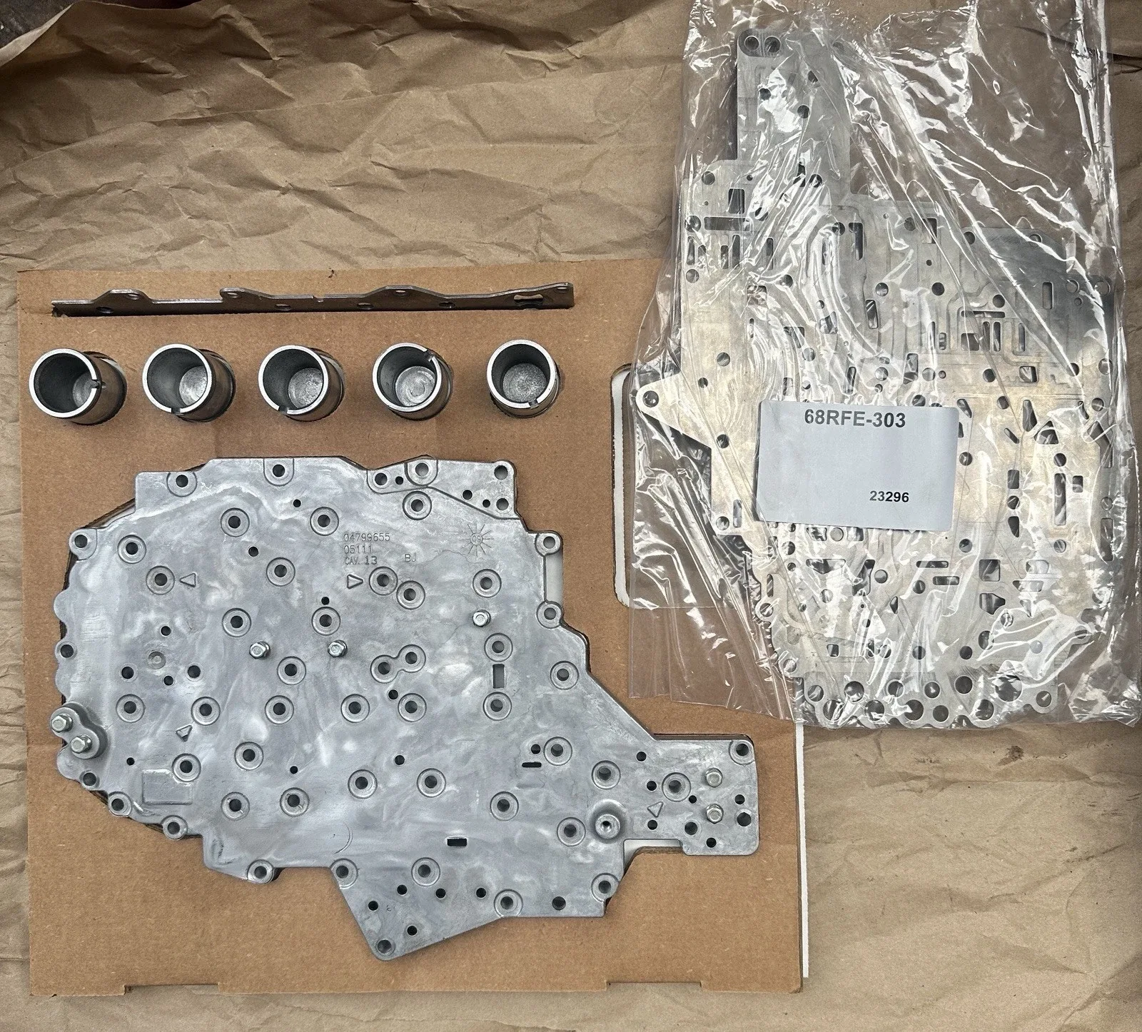 68 RFE Valve, Body Channel Plate, Pistons, Piston Retainer, And Separator Plate